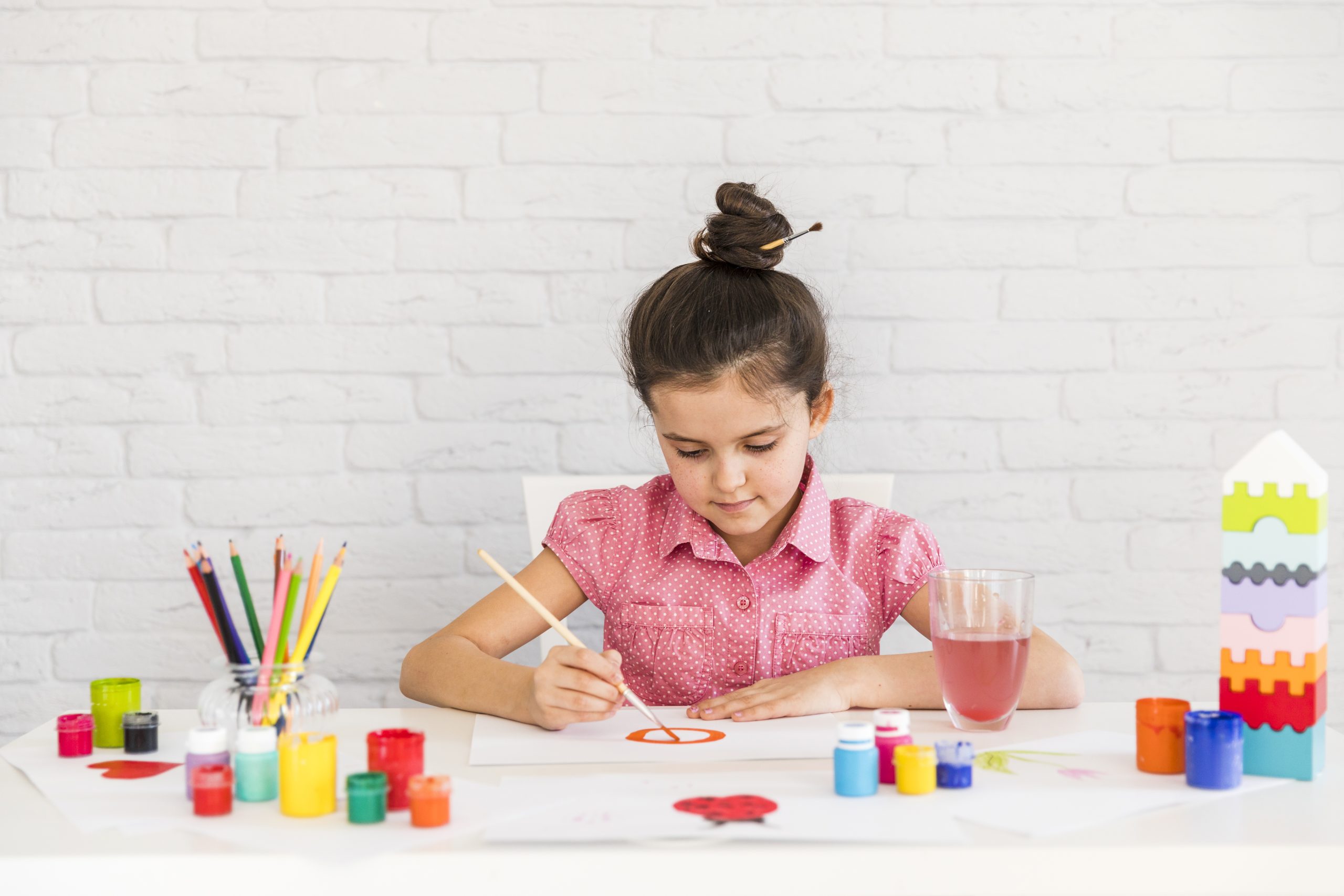 portrait-girl-painting-white-paper-with-paintbrush