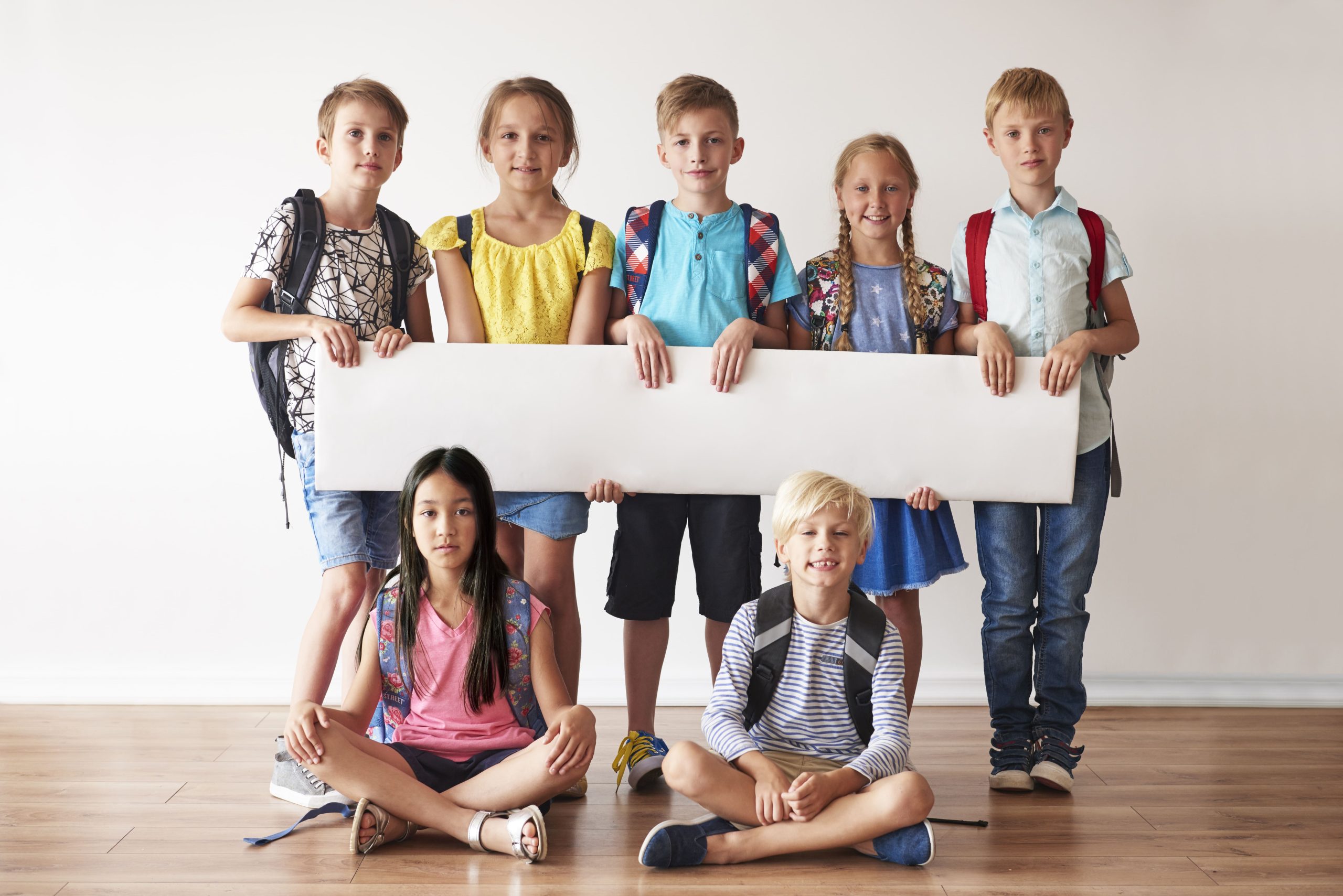 school-friends-with-white-placard